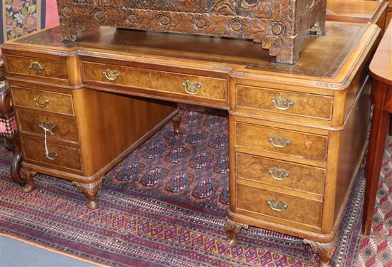 A 1920s Georgian Revival walnut pedestal desk W.152cm